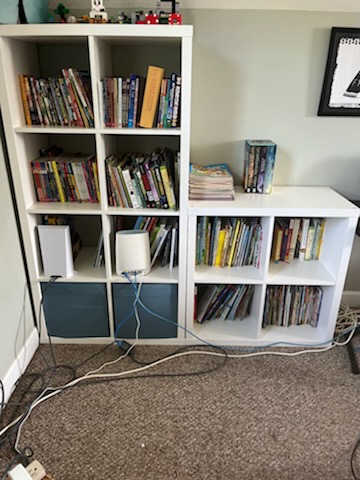 bookshelf straightened up after maid service